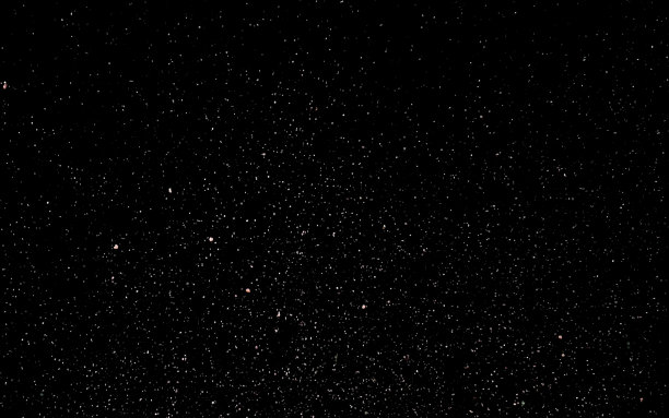 抽象背景与闪闪发光的雪花。彩色尘埃的微粒闪闪发光。图片下载