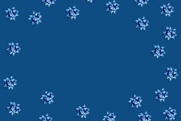 蓝色背景与蓝色蝴蝶结的圆形框架。图片下载