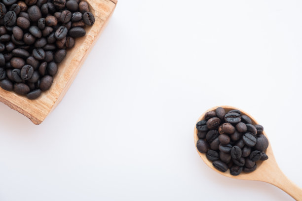 棕色和黑色的烤阿拉比卡咖啡豆。烤咖啡豆泥是浓缩咖啡，卡布奇诺，拿铁，摩卡，美式咖啡的原料。咖啡是早上和下午休息时最受欢迎的饮料图片下载