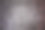 暗色的紫红色和棕红色背景灰泥墙。图片下载