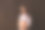 穿着牛仔裤短裤和蓝色衬衫的孕妇双手放在深棕色的背景上。怀孕、分娩、准备和期望概念。美丽柔情的怀孕照片图片下载