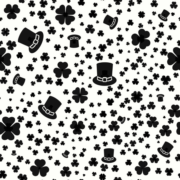 黑色的帽子和三叶草叶子在白色的背景上。图片下载