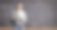 女孩背着书包，拿着书站在黑板前，上面写着数学公式素材图片