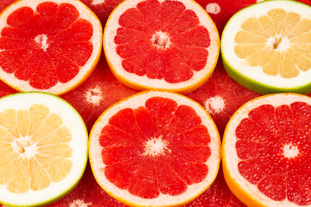 柚子和葡萄柚片背景。图片下载