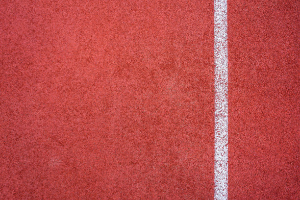 跑步轨道红色地面橡胶覆盖纹理背景。图片下载