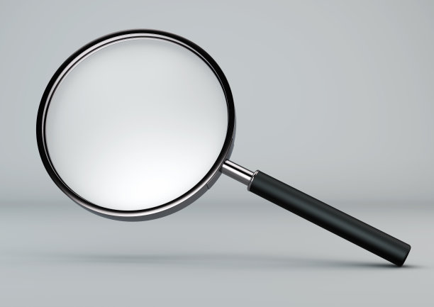 在灰色背景上的放大镜。图片下载