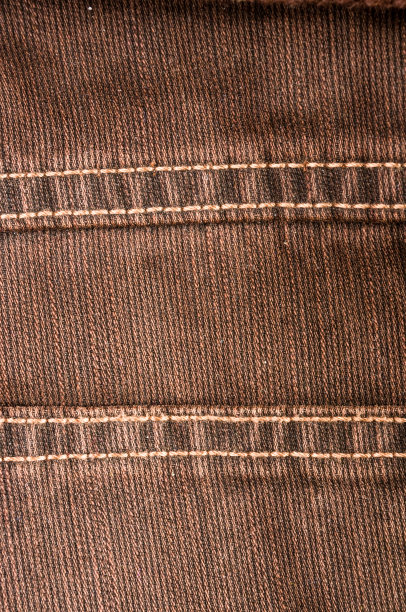 衣服项目石洗棉织物纹理接缝，扣，钮扣和铆钉，宏观图片下载