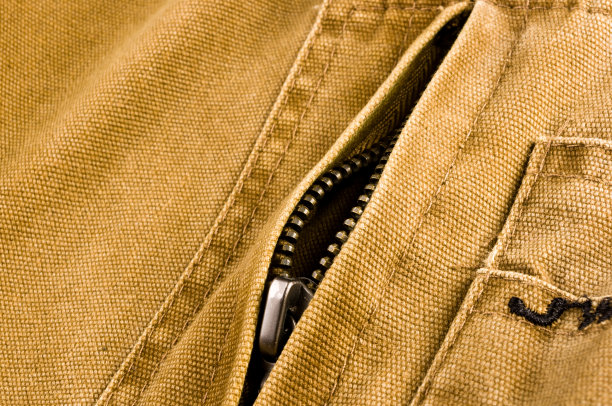 衣服项目石洗棉织物纹理接缝，扣，钮扣和铆钉，宏观图片下载