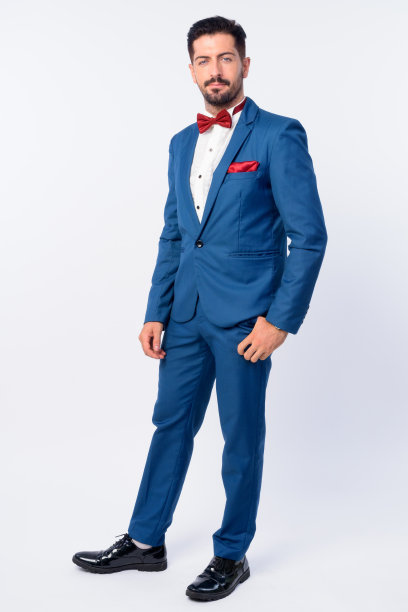 全身照片年轻英俊的胡子商人在蓝色西装图片下载