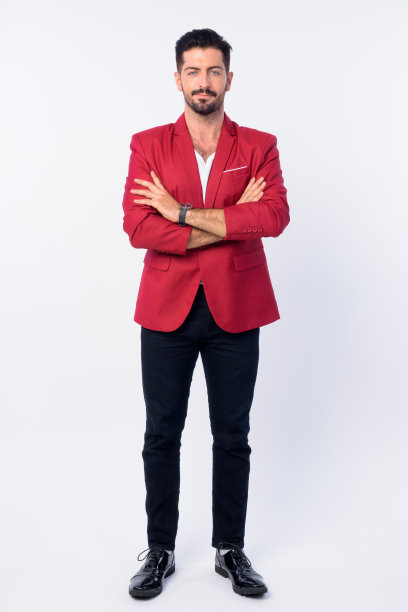 全身的年轻英俊的胡子商人在红色西装图片下载