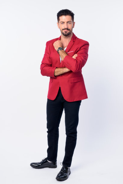 全身的年轻英俊的胡子商人在红色西装图片下载