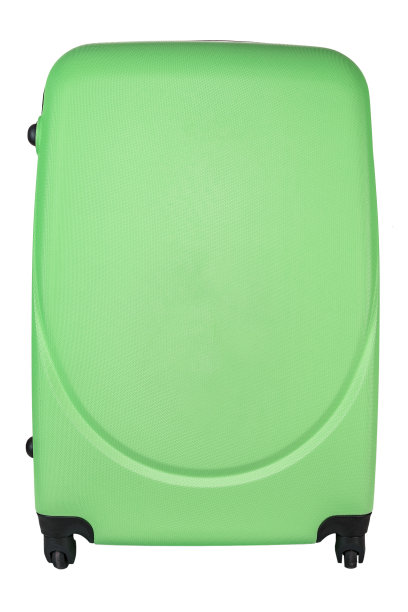 带轮子的手提箱是绿色的，在一个白色的孤立背架上。图片下载