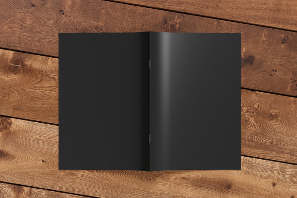 小册子或小册子封面模拟。小册子是开放的，上下颠倒的。图片下载