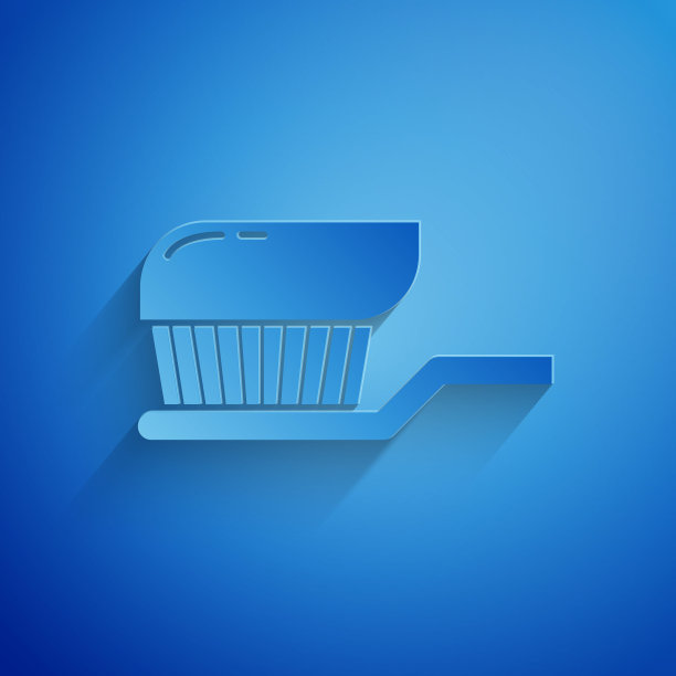 剪纸牙刷与牙膏图标隔离在蓝色背景。纸艺术风格。矢量图图片下载