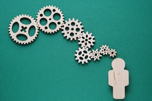 摘要人与齿轮-业务的概念，功能，效率，联锁部分。图片下载