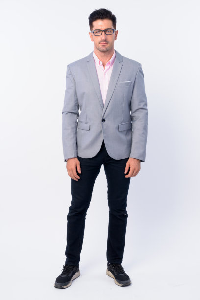 全身拍摄的年轻英俊的商人与眼镜图片下载