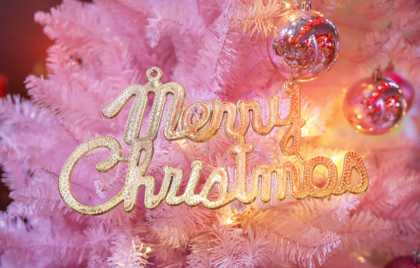 圣诞快乐写在圣诞粉红色的背景图片下载