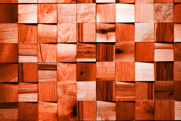 红色茂盛的硬木木方块在粗糙的墙面上纹理。葱郁的熔岩色，2020年新年的潮流色。抽象的背景图片下载