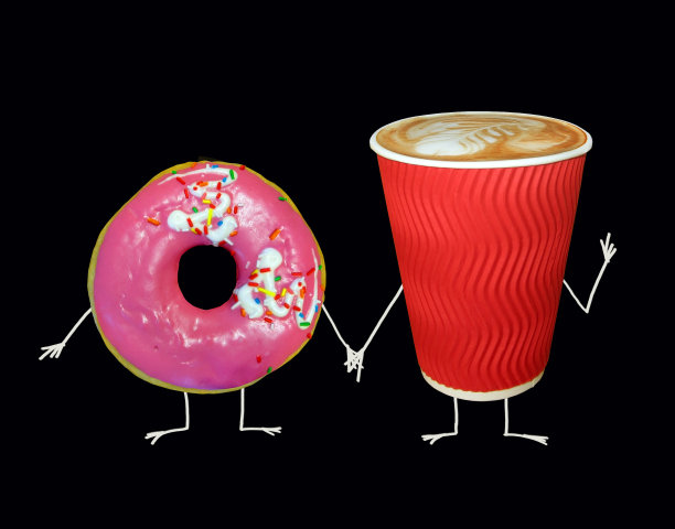 一杯粉红甜甜圈的咖啡图片下载