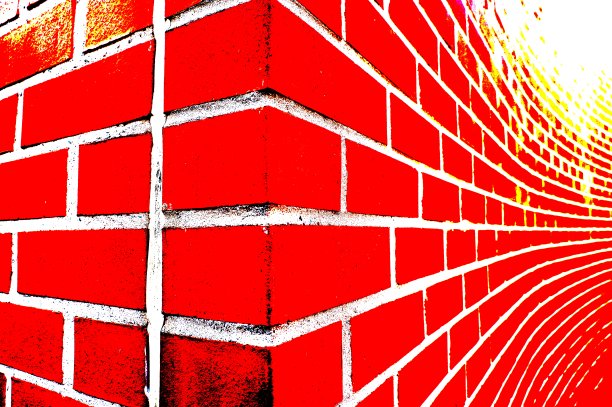 明亮的红色石头墙与明亮的白色接缝在广角看图片下载