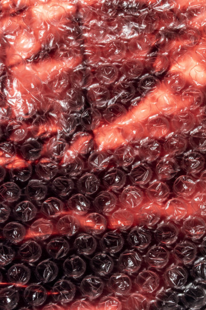 圆形气泡膜和光面纸抽象背景特写图片下载