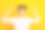 特写照片的美丽的女士表明手指在新的沙龙发型不喜欢两个发髻准备浪漫的约会穿心形图案白色红色毛衣孤立的黄色背景图片下载