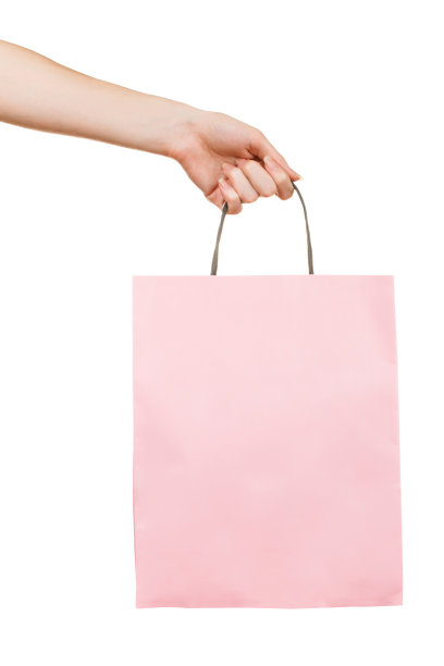 手用白色的粉色纸袋图片下载