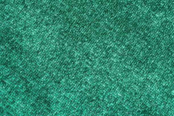 深绿色天鹅绒对角线背景和纹理设计特写。图片下载