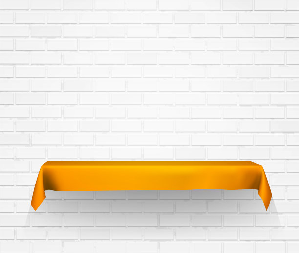 砖墙和架子上覆盖着金色的布。图片下载