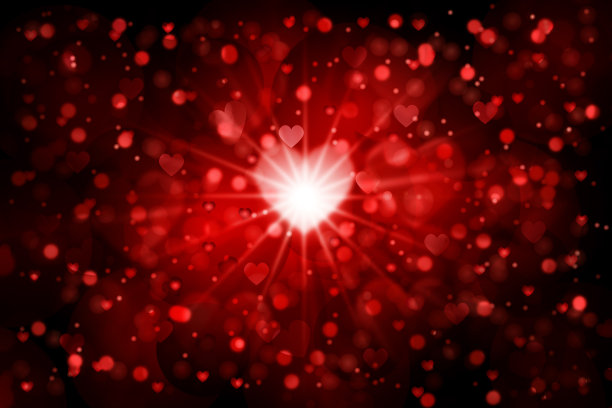 抽象的红色散景背景与心脏形状。图片下载