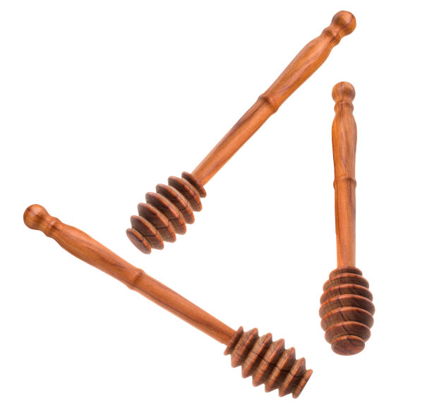 一套蜂蜜木制勺孤立在白色的背景图片下载