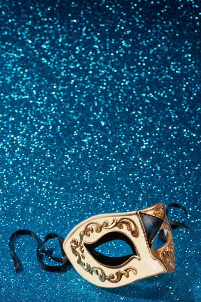 威尼斯狂欢节面具与蓝色闪光的背景图片下载