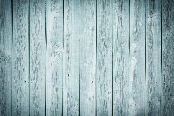 木头栅栏的碎片。板子的结构。浅绿色背景用于布局。照片和装饰图案。图片下载