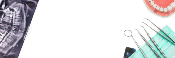 由牙医工具制成的旗帜，面罩和x光照片。图片下载