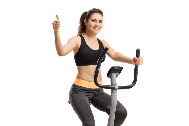 女孩骑着健身车，翘着大拇指图片下载