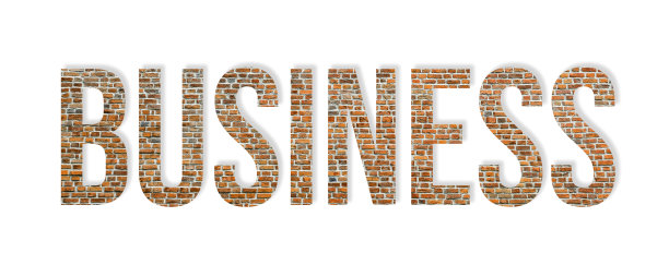 红色砖墙上覆盖着“商业”一词。商业成功的概念。业务的话图片下载