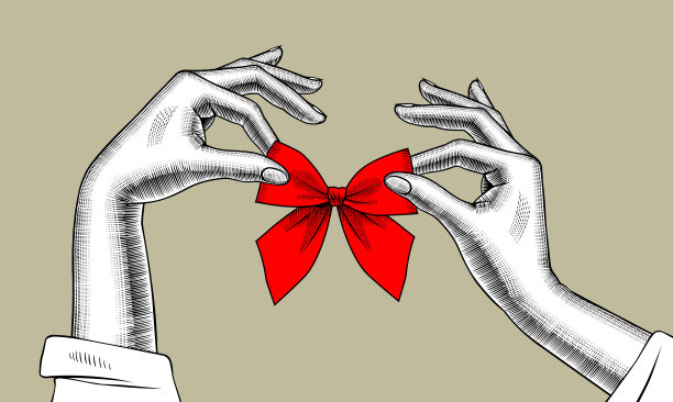 女人的手用红丝带系着蝴蝶结图片下载