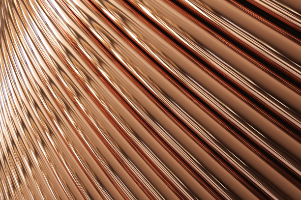 新堆砌的光亮сopper管在工厂。图片下载