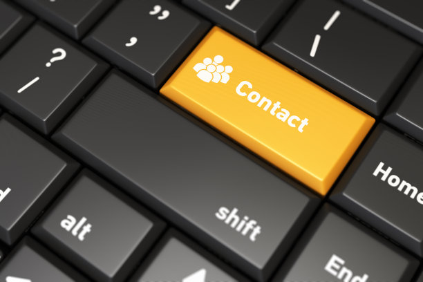 黑色键盘上的黄色联系方式按钮图片下载