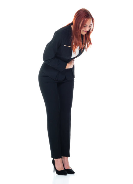 白人女商人鞠躬，穿着商务服装图片下载