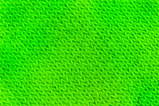 以绿色帆布为背景，用绿色毛线编织而成图片下载