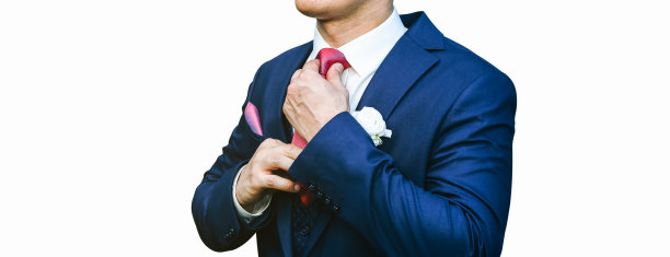 新郎孤立在白色背景上。蓝色的结婚礼服和红色的领带。时尚的细节。图片下载