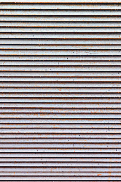 背景锈迹斑斑的金属网通气孔图片下载