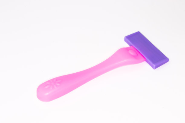 儿童玩具剃须刀孤立的白色背景。图片下载