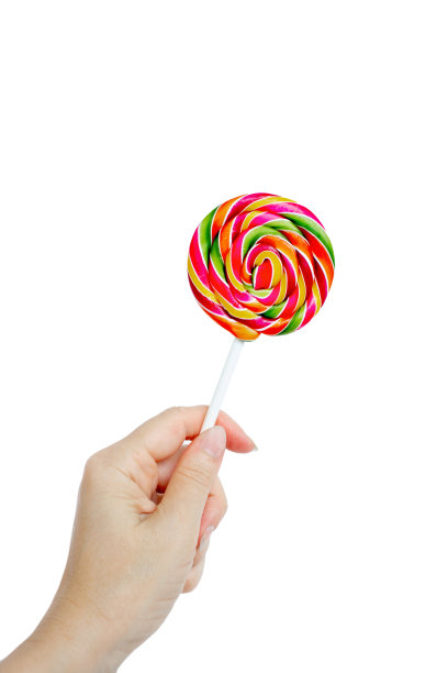 女人手里拿着美味的彩虹糖。复古的图片下载