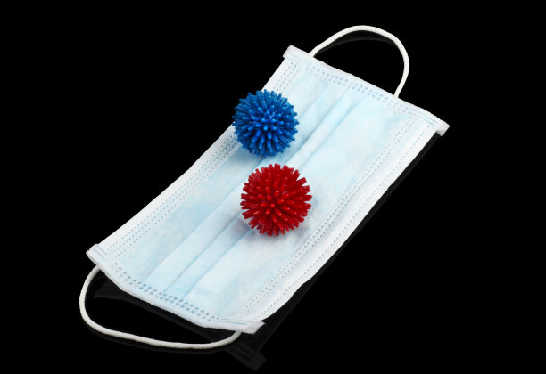 病毒模型位于防毒罩上，位于黑色背景上图片下载