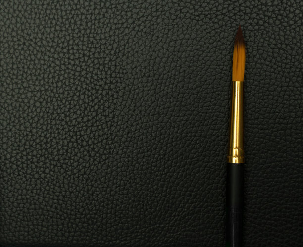 豪华黑色画笔艺术家绘画的人造皮革背景图片下载