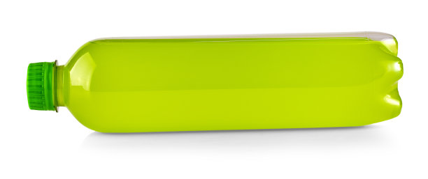 白色的瓶子上有绿色的果汁图片下载