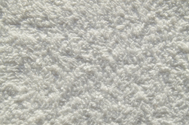 白色毛巾布柔软的浴巾用于SPA治疗，纹理，背景图片下载