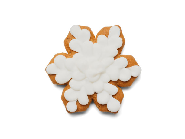 姜饼以雪花的形状特写，在白色的背景上有一个阴影。从上往下看图片下载